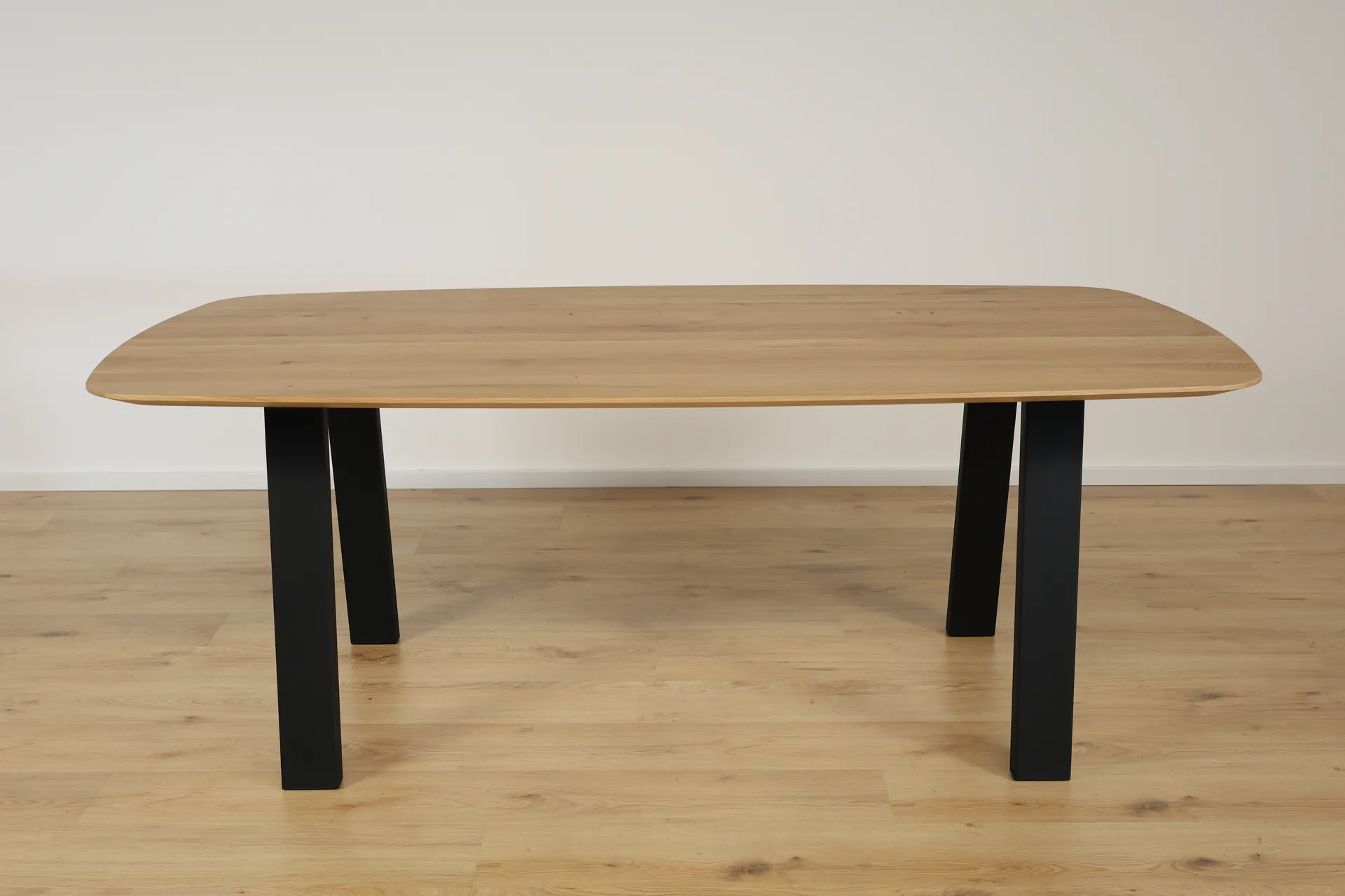 The Eclipse Beveled Oval European Oak Dining Table – product view 2